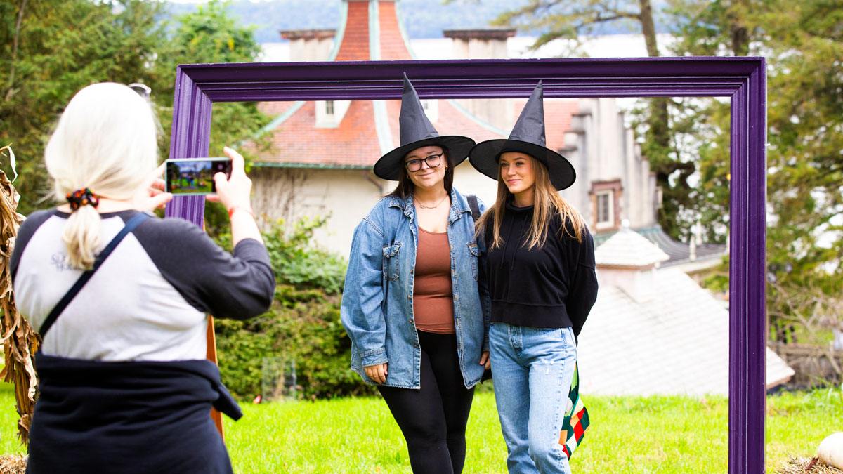 Two women dresses with witches hats