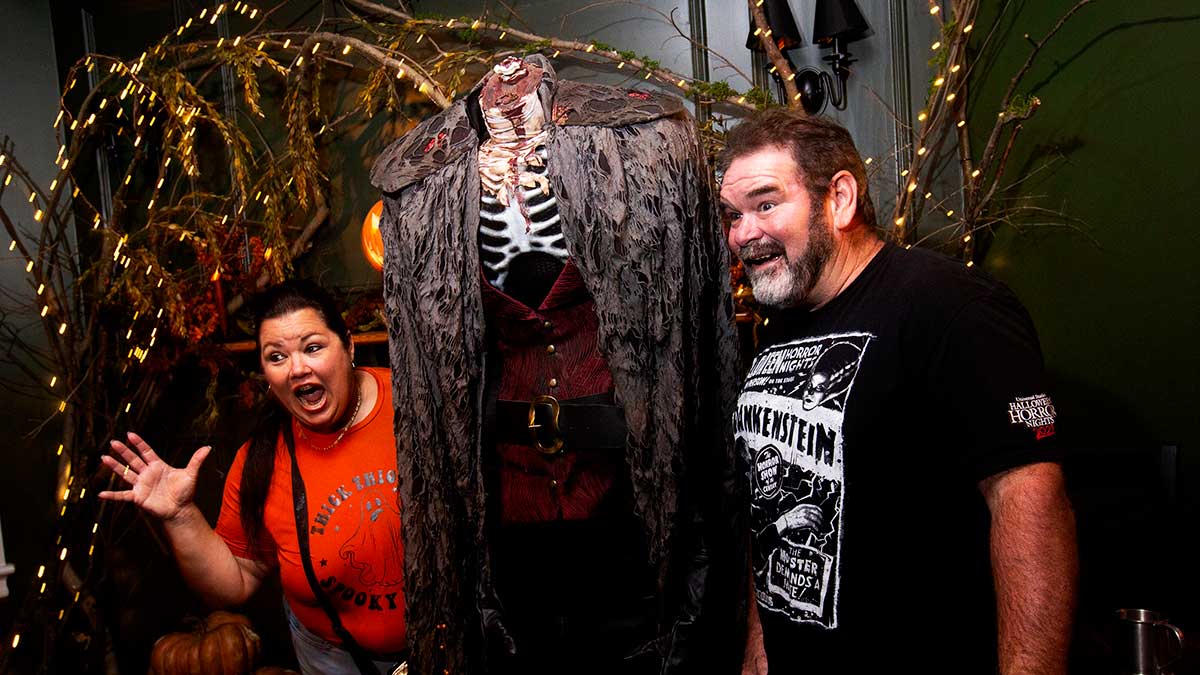 Visitors posing with the Headless Horseman